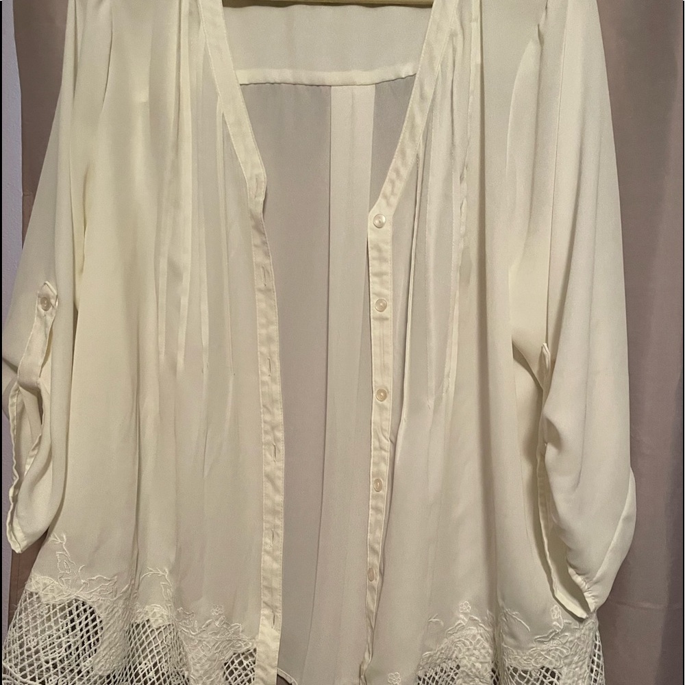 Zac & Rachel woman’s top. Cream color button down, lace accent bottom of blouse